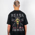 Raver mit schwarzem Being Human oversized T-Shirt in schwarz von Technostoff von hinten fotografiert